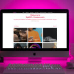 photo of desk with website open on laptop