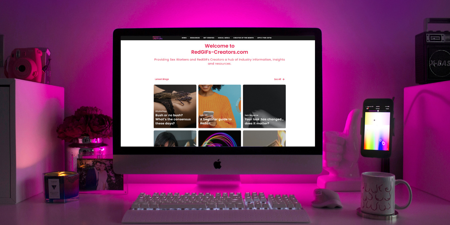 photo of desk with website open on laptop