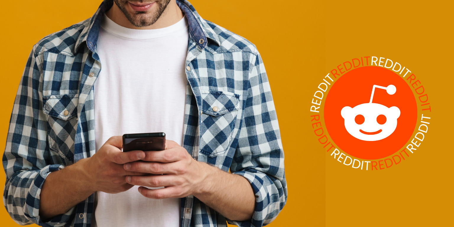 man on phone next to reddit logo