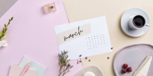 march displayed on a calendar with cup of coffee